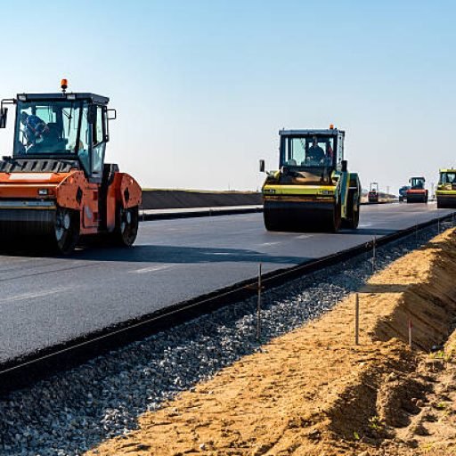 Road rollers building the new asphalt road