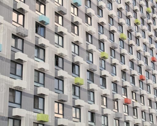 windows-of-residential-apartment-building-facade-of-a-modern-house-new-architecture-design-world-habitat-day-urban-infrastructure-development-concept-photo